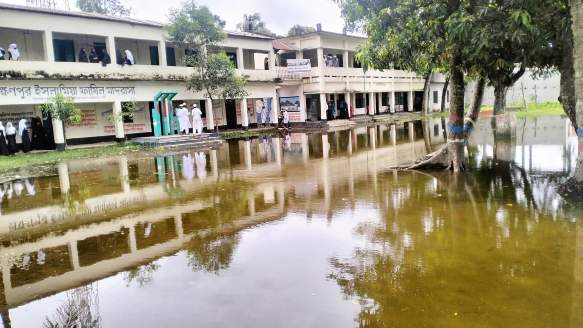 মনোহরগঞ্জে মাদরাসা মাঠে জলাবদ্ধতা,ডেঙ্গু আতঙ্ক ও দুর্ভোগে শিক্ষক-শিক্ষার্থীরা।